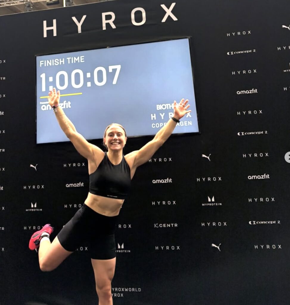 Annie Emilsson celebrates after finishing the HYROX Copenhagen Pro race in 1:00:07