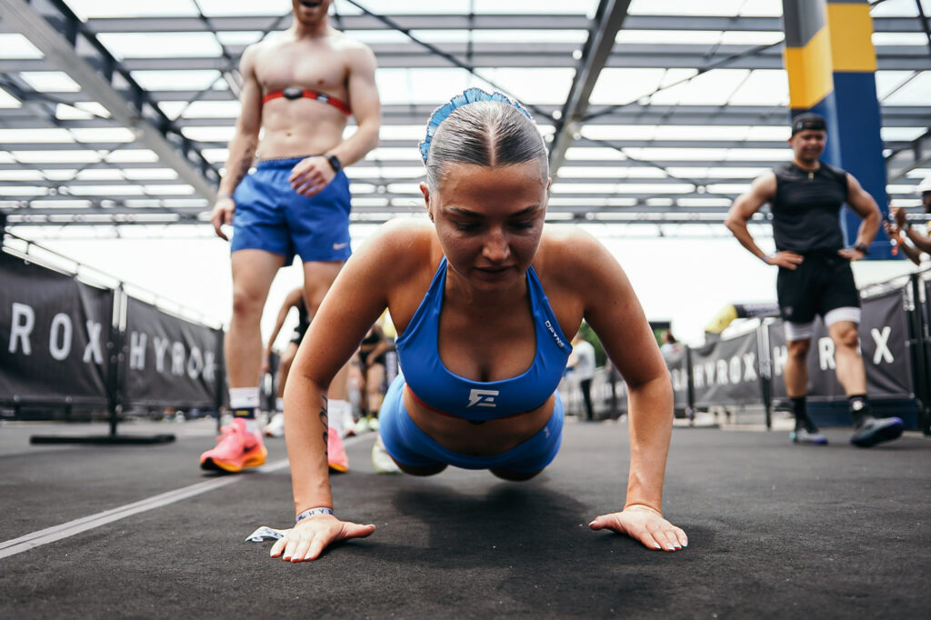 Athletes competing in the HYROX Mixed Doubles division during a floor workout at HYROX Worlds