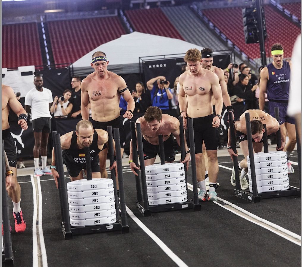 lite 15 men's doubles athletes on the sled push at a HYROX Major.