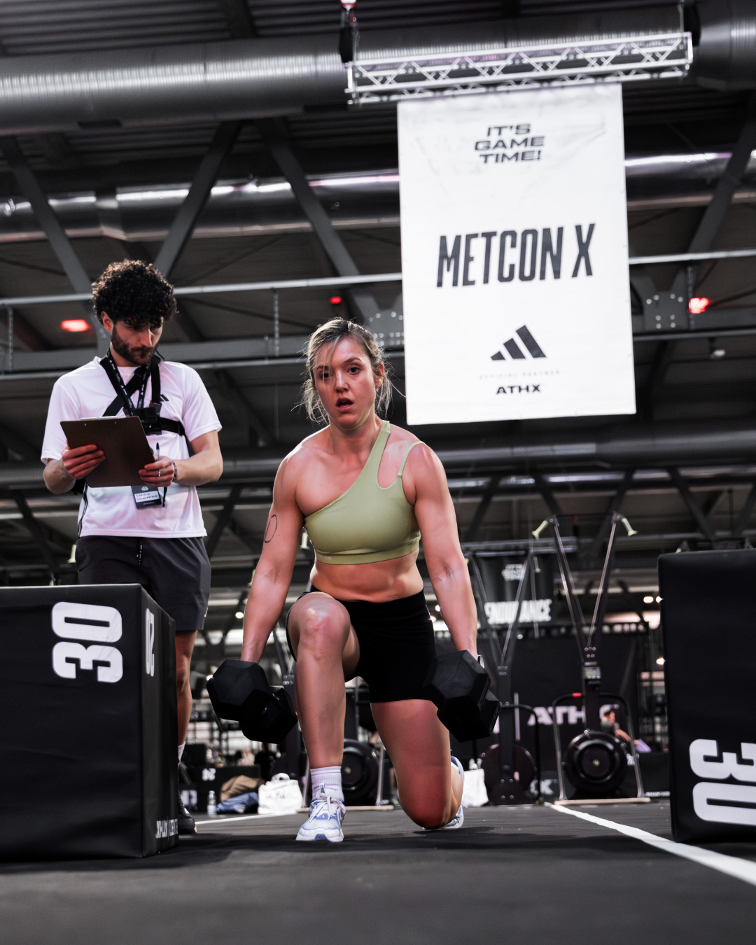 Athlete competing in the Metcon X zone during an ATHX fitness racing event