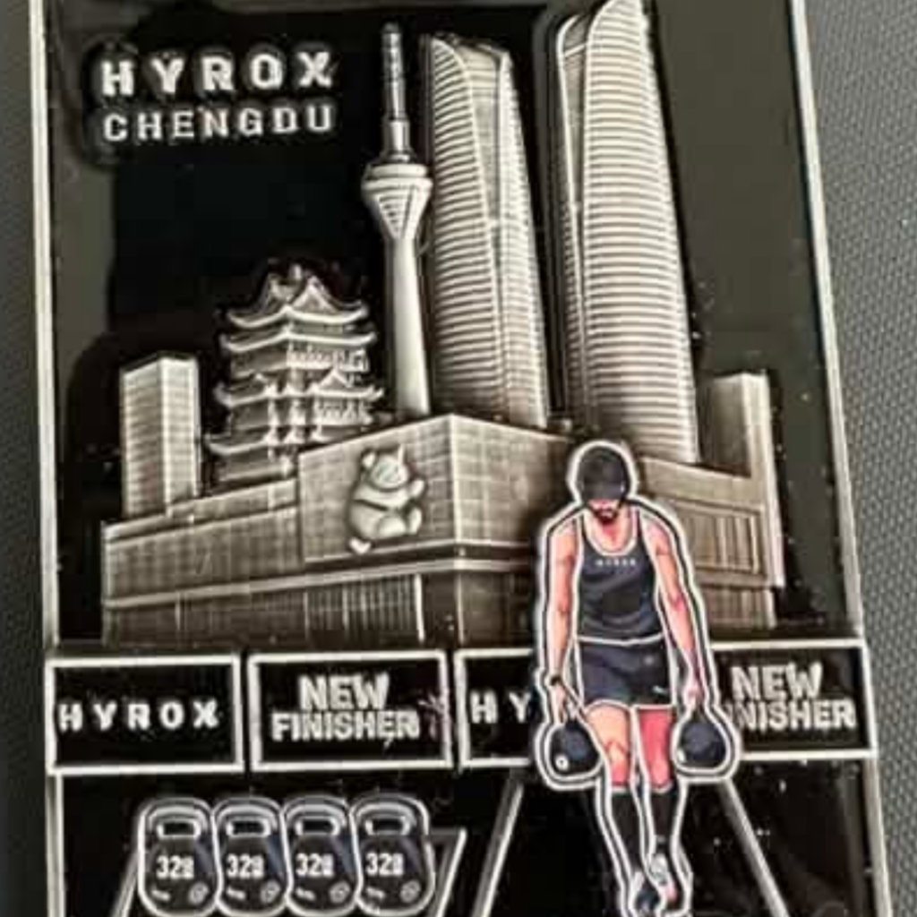 HYROX Chengdu finisher medal featuring a farmer’s carry station design
