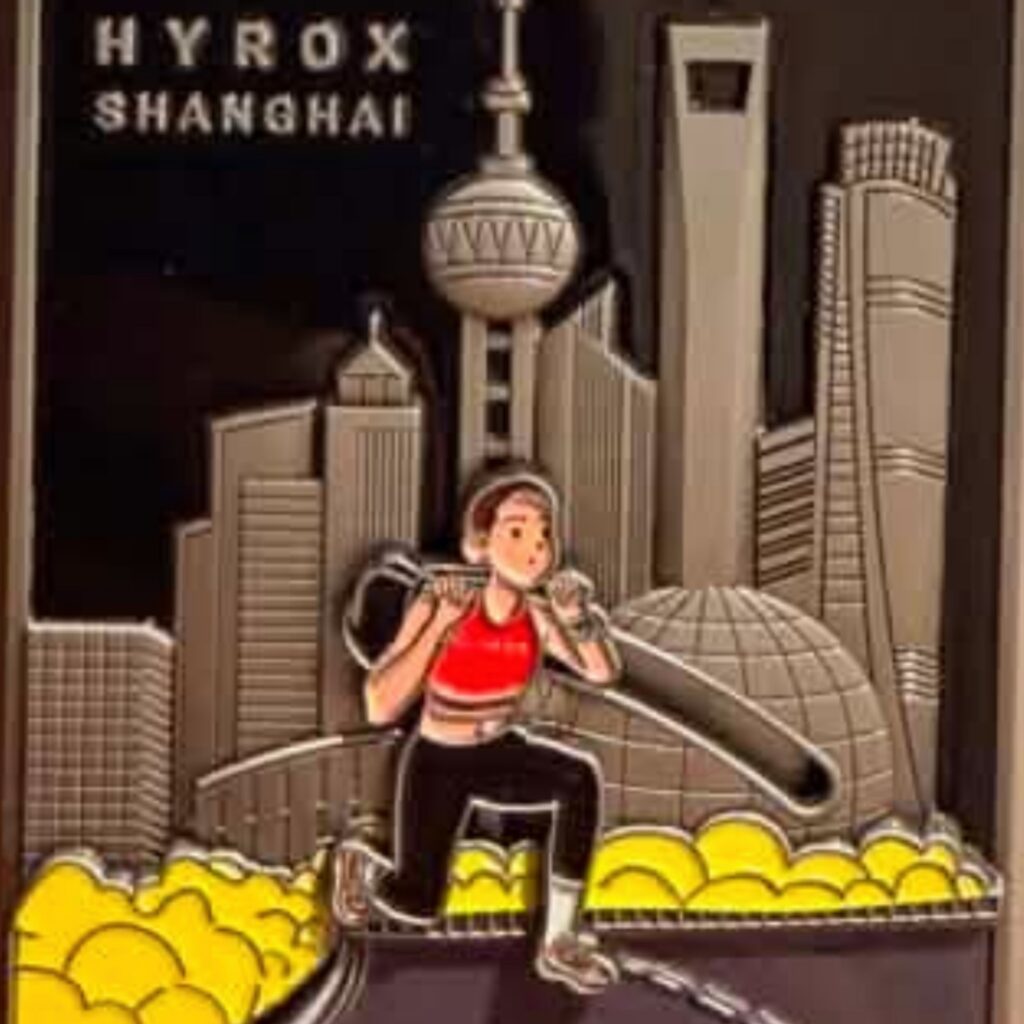 HYROX Shanghai finisher medal featuring a sandbag lunge station design
