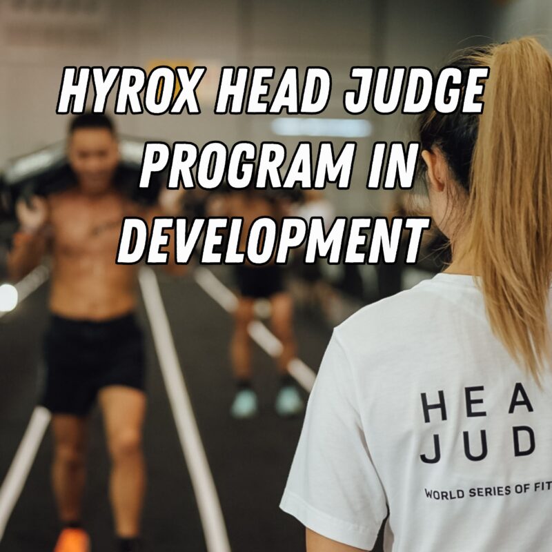 HYROX Head Judge watches athletes compete during a HYROX event.